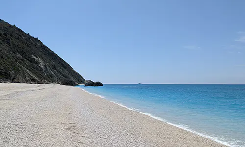 On the shore of Megali Petra Beach