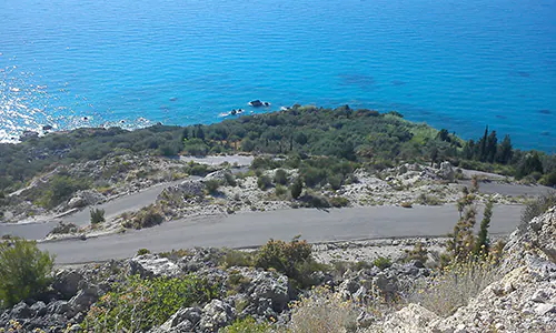 The winding road starting from Kalamitsi village and leading to Megali Petra and other nearby beaches