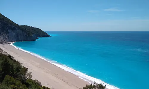 The turquoise waters of Milos Beach